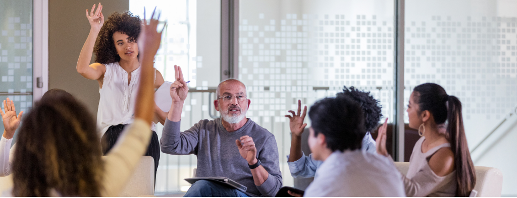 Hands holding a wooden house model, representing estate agency services and property sales in Lloret de Mar by Gabinet Senia Associats.